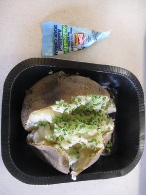 One baked potato with chives and sour cream. $1.39