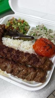 One serving of koobide includes: 2 skewers, tomato, pepper, salad shriazi, sliced onions, rice and pita bread. $8.99 + tax