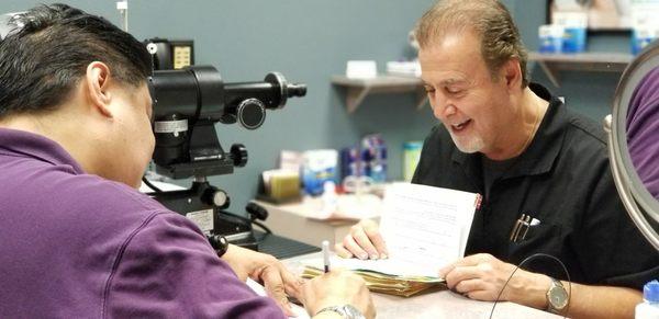 Dr. Lyons checking patient's records.