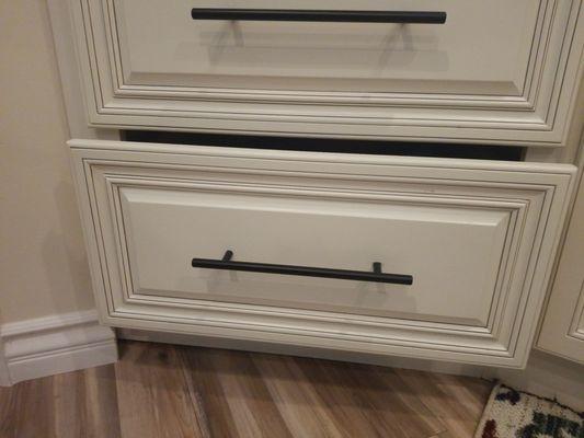 Two drawers and one hole! Bottom drawer false out when opened.  Nice!!