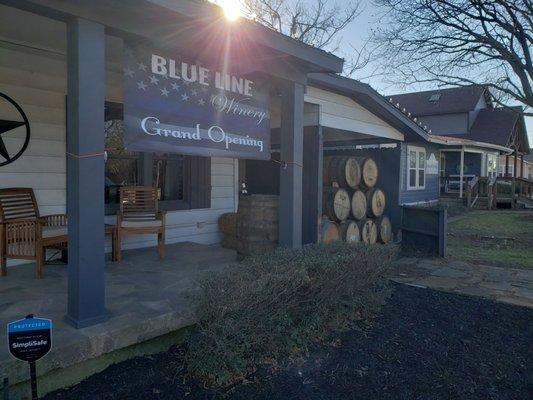 Front, closer, with wine barrels in what was once a house carport. And, front porch.