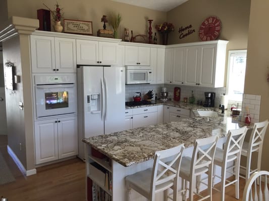 New white cabinets added a modern ambiance to this old kitchen.