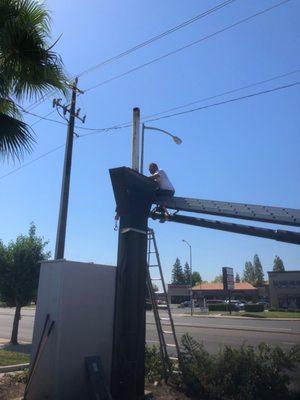 Dale Hicks preparing the pipe to accept my replacement electronic billboard