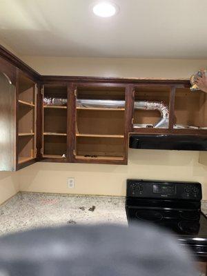 How the kitchen cabinets look before painting.