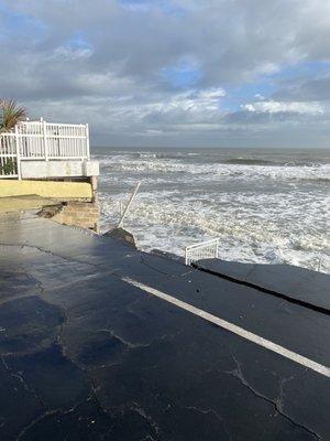 Hurricane damage beach  access is gone. Waves break right at the collapsed area.