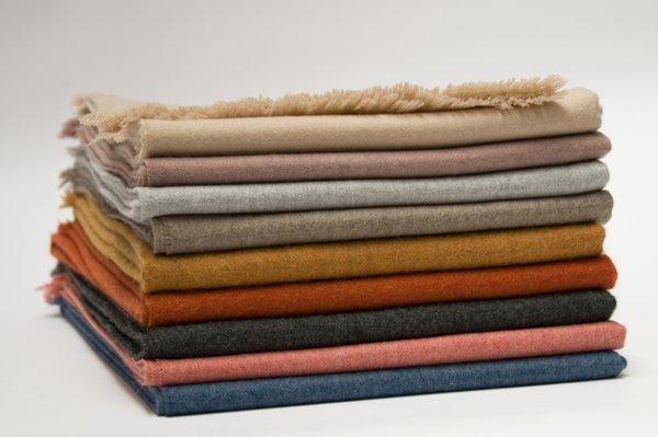 LIAM baby alpaca throws in sugar, fig, soft grey, almond, spice, poppy, graphite, rose & blue.