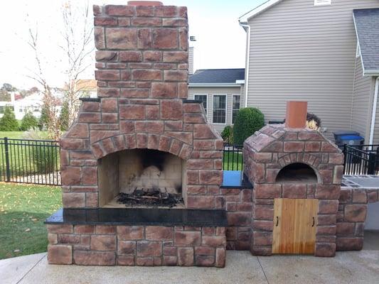 CraftMasters outdoor fireplace kit with a CraftMasters pizza oven kit.