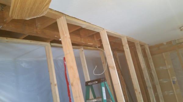 Replacing structural beam to open up kitchen.