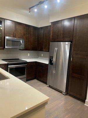 The kitchen is spacious. There is a wine rack/nook with the room, which I love!