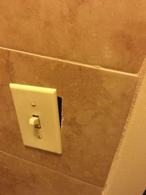 Light switch falling out of wall