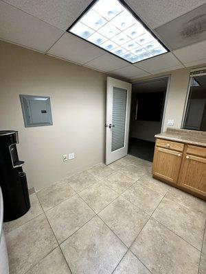 Office kitchen repaired walls, primed and painted