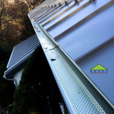 Newly installed metal roof and gutters with Gutter Guard