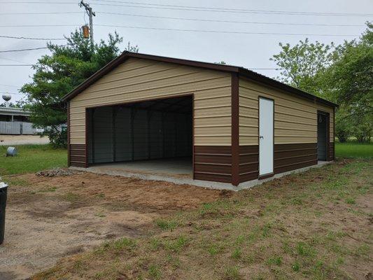 24x30 two tone garage with 16' overhead door, service door and 6' roll up door!