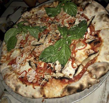 Sausage and basil pizza