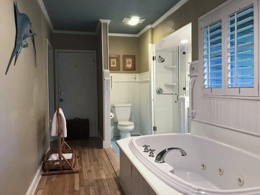 Private baths in our guest cottages feature glass shower enclosures and whirlpool tubs-for-two.