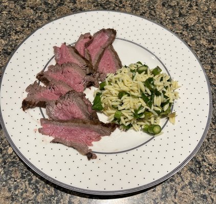 Your tasty tri tip, oven baked to 120 degrees then broiled to perfect medium rare.  Served with local asparagus orzo salad.