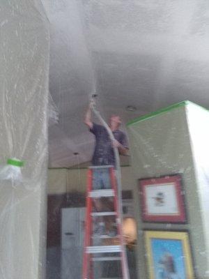 That's me, Ray, spraying knockdown on the ceiling after scraping off all of the popcorn throughout the house.