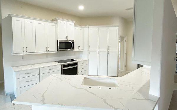 Super clean Quartz countertops in a new kitchen