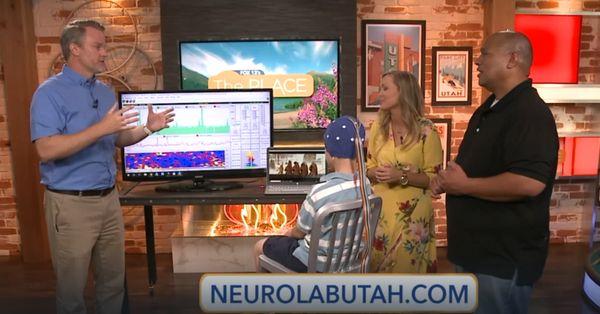 Demonstrating Neurofeedback on Fox 13's The Place to Raquel Baldwin and Big Buddha