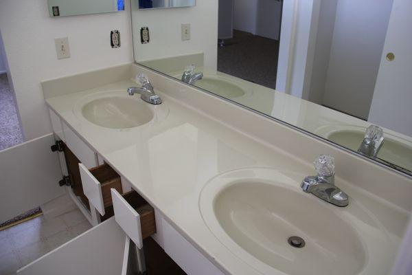 Here is the entire cultured marble sink and countertop after being refinished. Completely updated and modernized.