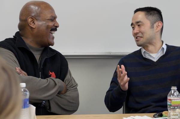 Dr. Roger Nam (right) spends some time with one of his advisees.