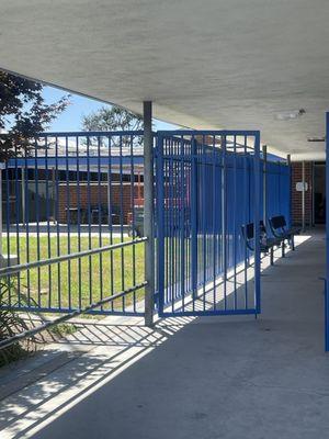 Fence & gates painted blue at Westminster Schools.