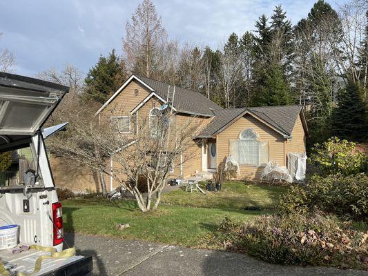 Entire house repainted with new gutters.