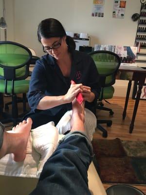 Jen giving the bet pedicure.