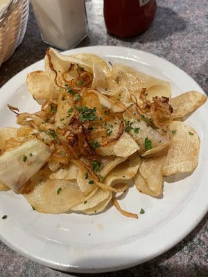 Sicilian potatoes - kind of like scalloped potatoes without the cream sauce. Interesting and not bad with some salt.