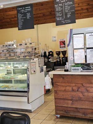 The main counter with menus hanging from the ceiling.