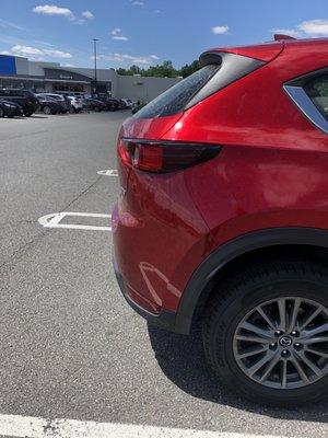 Clearly shows that the painted bumper is a different color than the red paint code of the Mazda CX-5