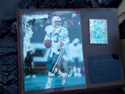 A ruined signed and framed Dan Marino plaque...  Madison Apartments did NOT want to buy it