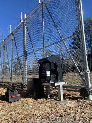 Chain link fence with gate operator