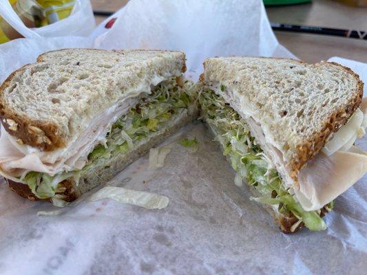 Turkey on whole wheat w/ sprouts, lettuce & cheese