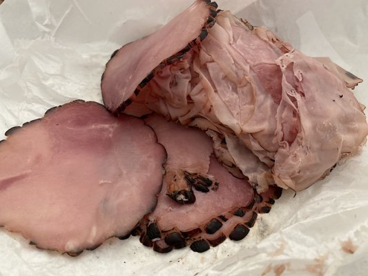 Four different styles of sliced ham.