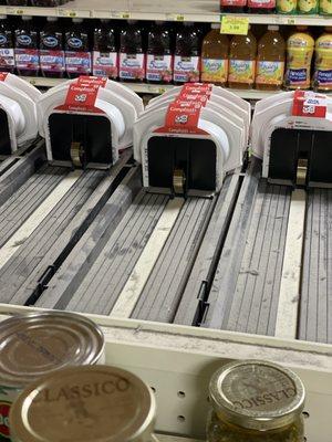 Dirty, disgusting shelves, and dirty, expired cans of food.