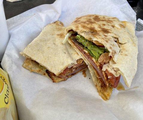 Folded Italian sandwich on dough bread, each half was as big as the bag of chips it came with!