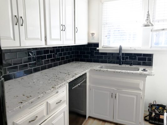 Removed old tile for a new updated backsplash.