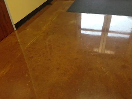 Polished concrete with a dye.