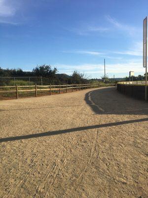 Trails entrance is to the left of the ball diamonds and runs parallel to the San Diego River basin.