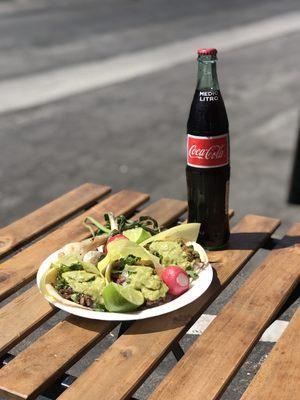 Delicious tacos de Asada w/ an iced cold Coca Cola