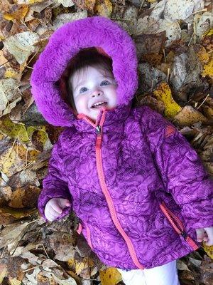 Playing in the leaves on playground at daycare.