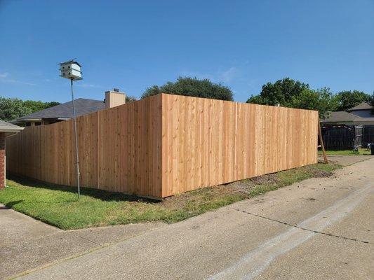 Beautiful cedar privacy fence installed as well as retaining wall!