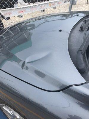 Dropped car off with zero hood damage