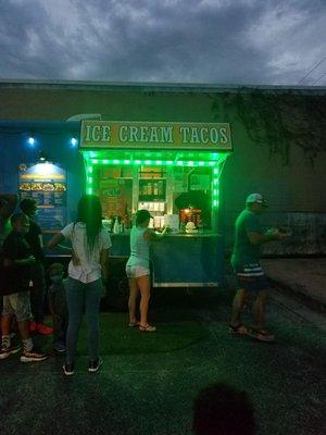 Outside the taco truck at night