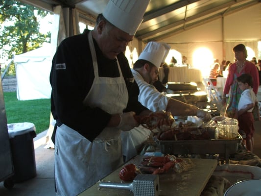 Chef with the lobsters. Notice how there are hundreds behind him.