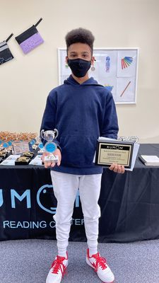 Alexis Favre (9th grader) receiving his silver award from Kumon