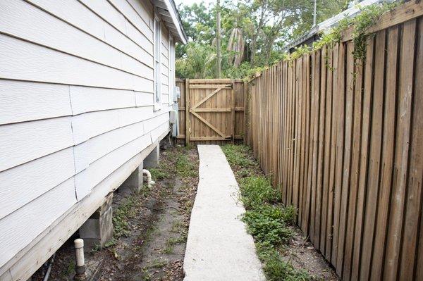 After Picture Concrete Walkway and Wooden Fencing