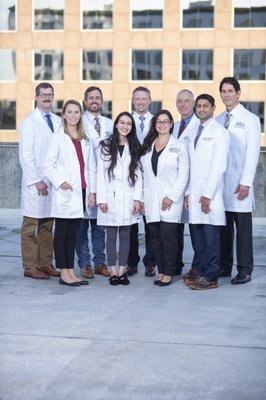 Back: Dr. Hillin, Dr. Brian White, Dr. Newsum, Dr. George White, Dr. Pirozzolo Front: Kathryn, PA-C; Lillie, PA-C; Nora, PA-C and Dr. Patel