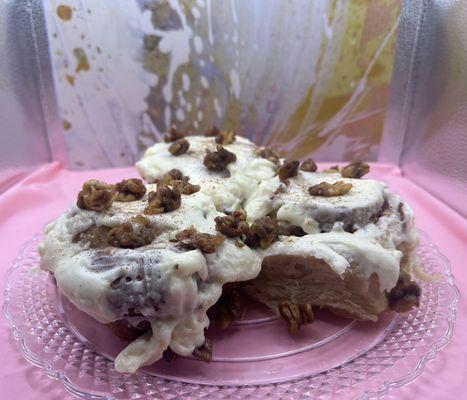 Carrot cake cinnamon rolls with cream cheese frosting and candied walnuts